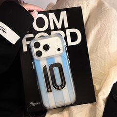 Clear blue striped soccer iPhone case with No.10 graphic displayed on a book