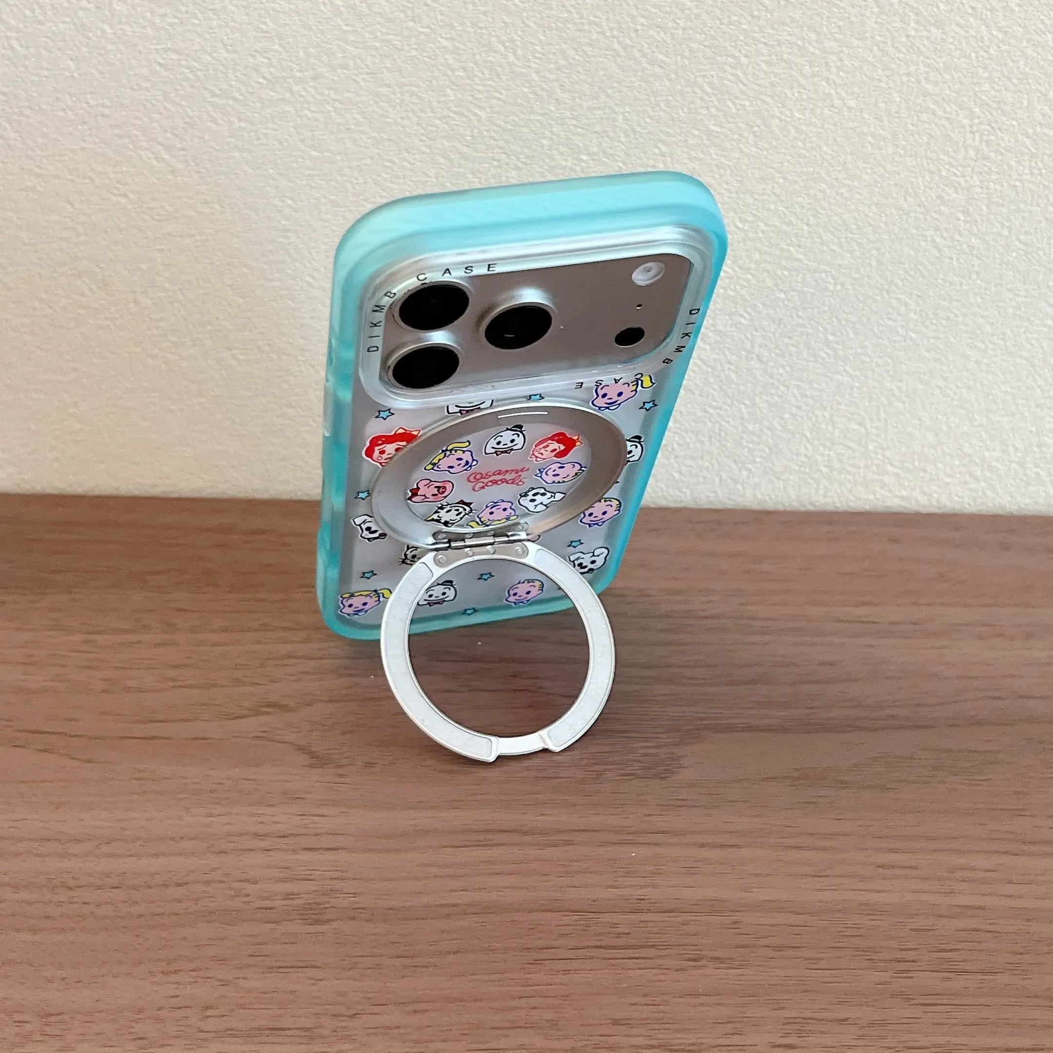 Bottom close up view of a clear phone case with a transparent cyan shockproof jelly bumper edge.