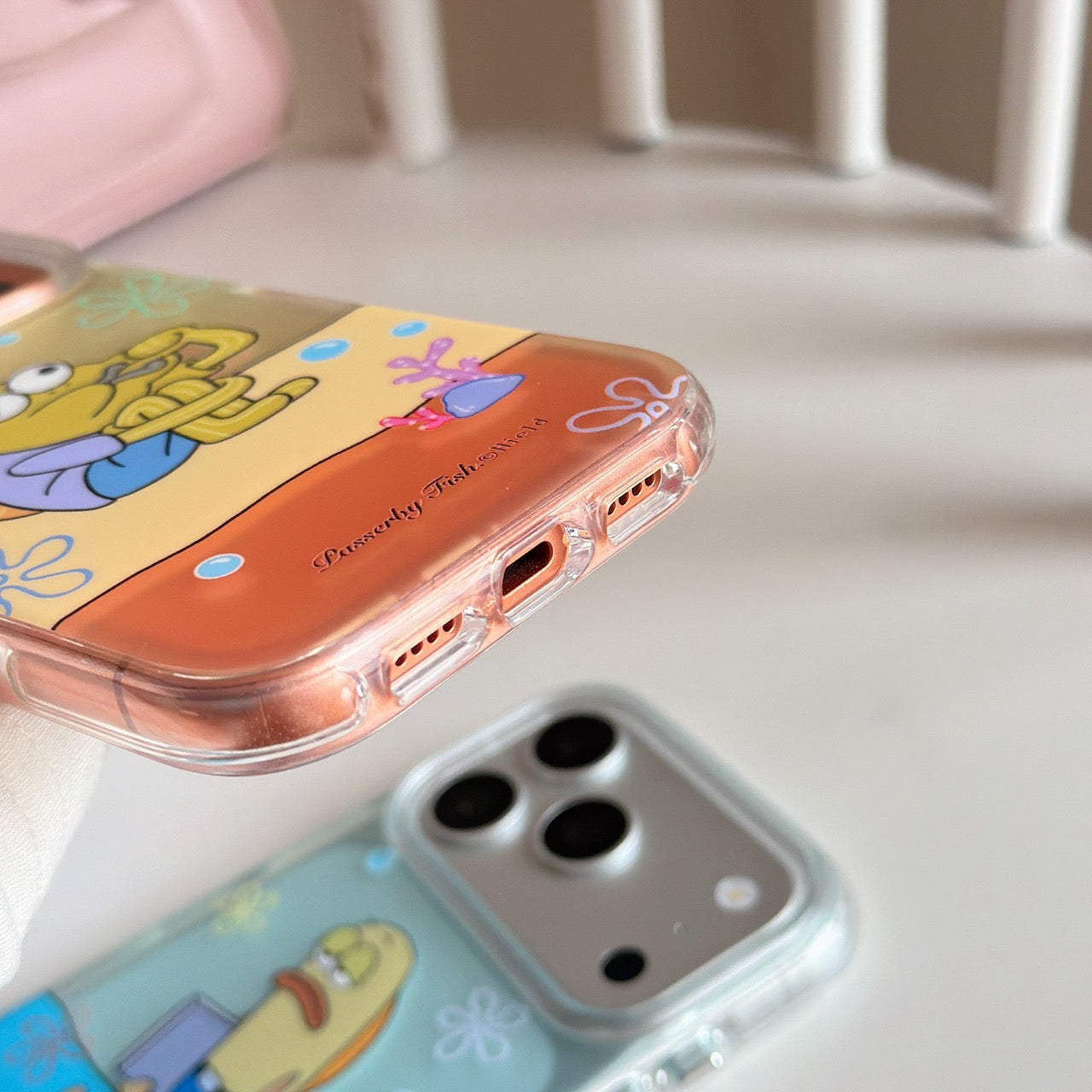 Detailed close-up showing the precise bottom speaker and charging port cutouts of a clear protective phone case.