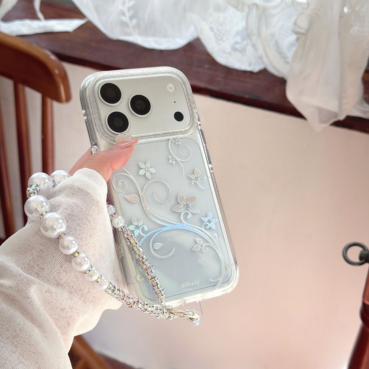 Clear silver floral vine iPhone case with pearl wrist strap