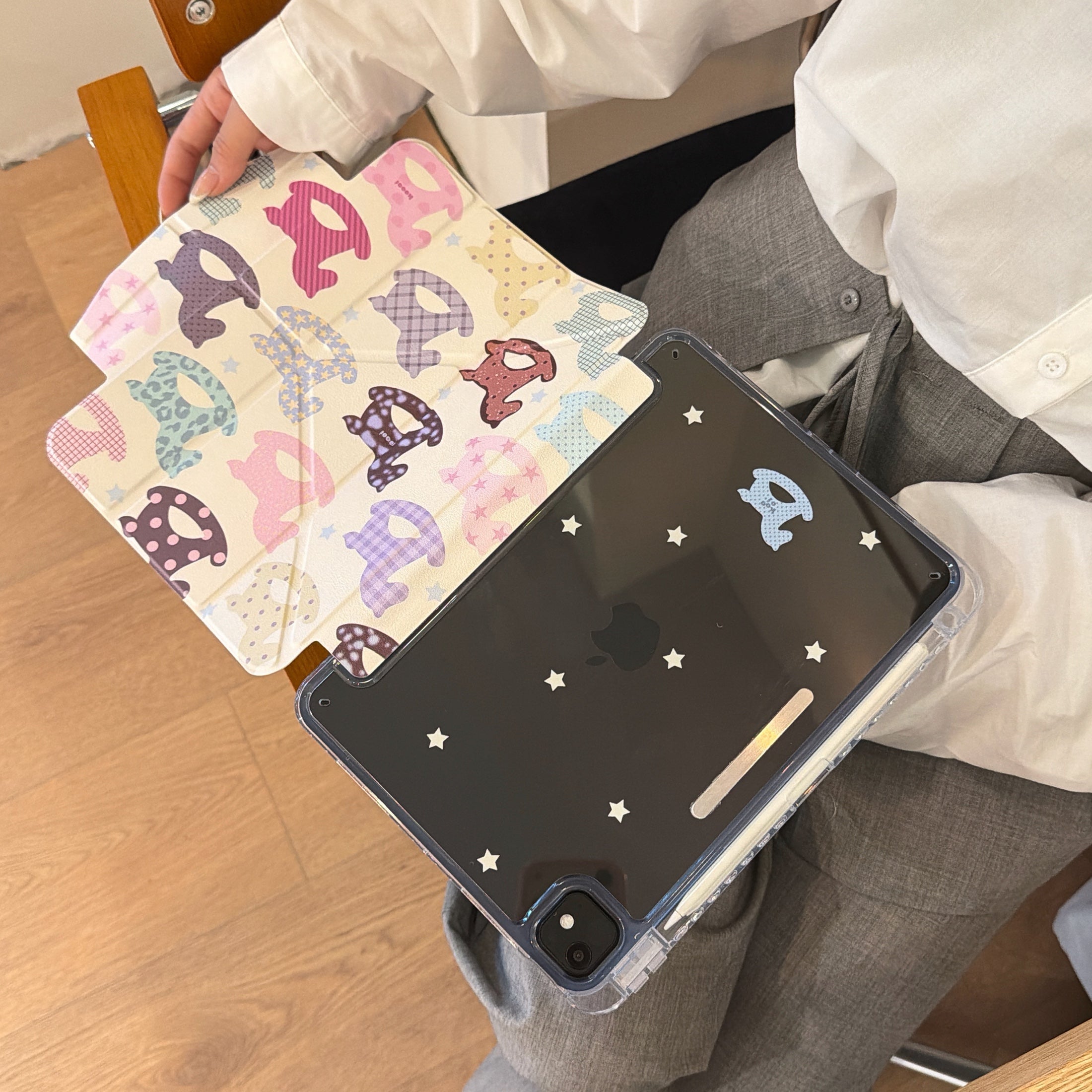 An open view demonstrating the separation of the magnetic front flap from a clear star back protective ipad folio shell.