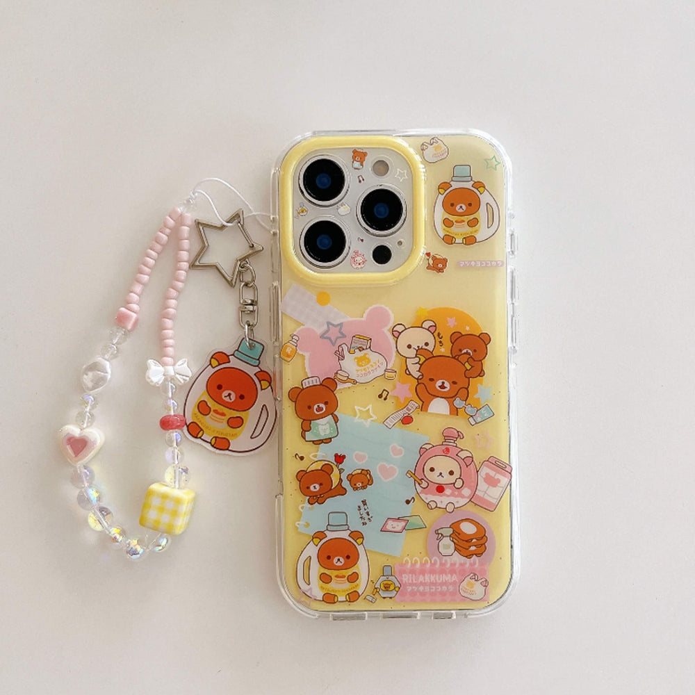 A clear yellow protective phone case printed with cartoon bears, displayed flat next to a matching beaded star strap on a white background.