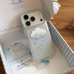 Two variants of the 3D cloud star phone case in silver and orange displayed on a wooden table.