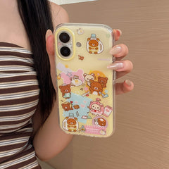 A hand showing the back profile of a clear protective phone case with yellow details and cartoon bear patterns against a wooden surface.