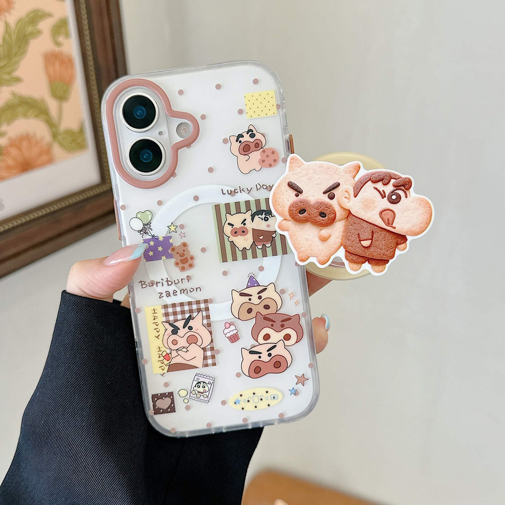Hand holding a cute cartoon pig iPhone case with matching character grip.