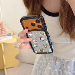Hand holding a black bumper mirror iPhone case with cute kitty decals