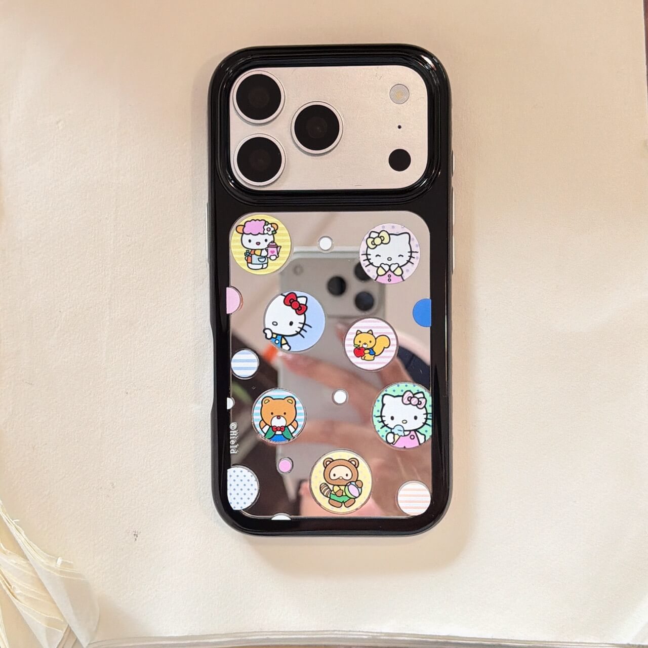 Cute kitty sticker mirror iPhone case with black bumper on white background