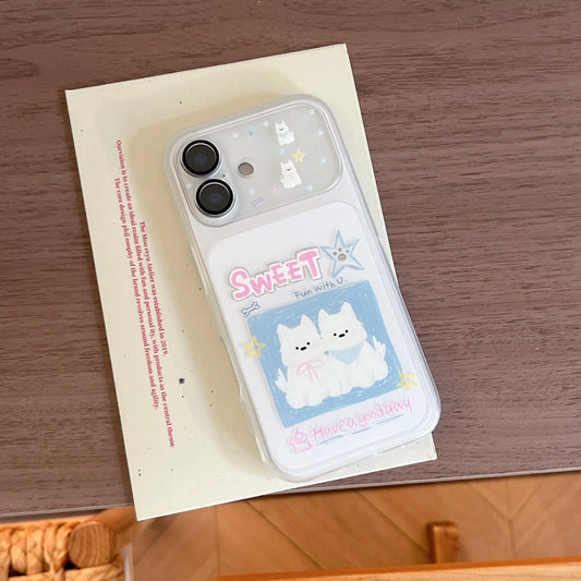 An aesthetic flat lay of a cute puppy cartoon iPhone case resting on a vintage cream postcard.