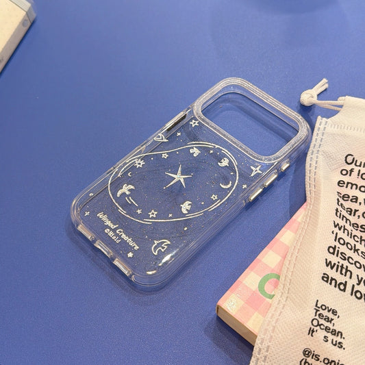 A dark navy blue glitter iPhone case decorated with holographic silver starry sky and flying bird line art, placed on a blue background.