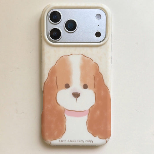 Front product view of a cream iPhone case with a long-eared fluffy puppy.