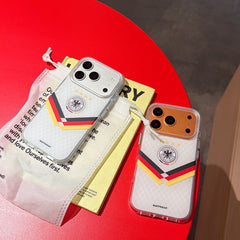 Silver and orange gold Germany mirror phone cases displayed with aesthetic lifestyle packaging on a red table.