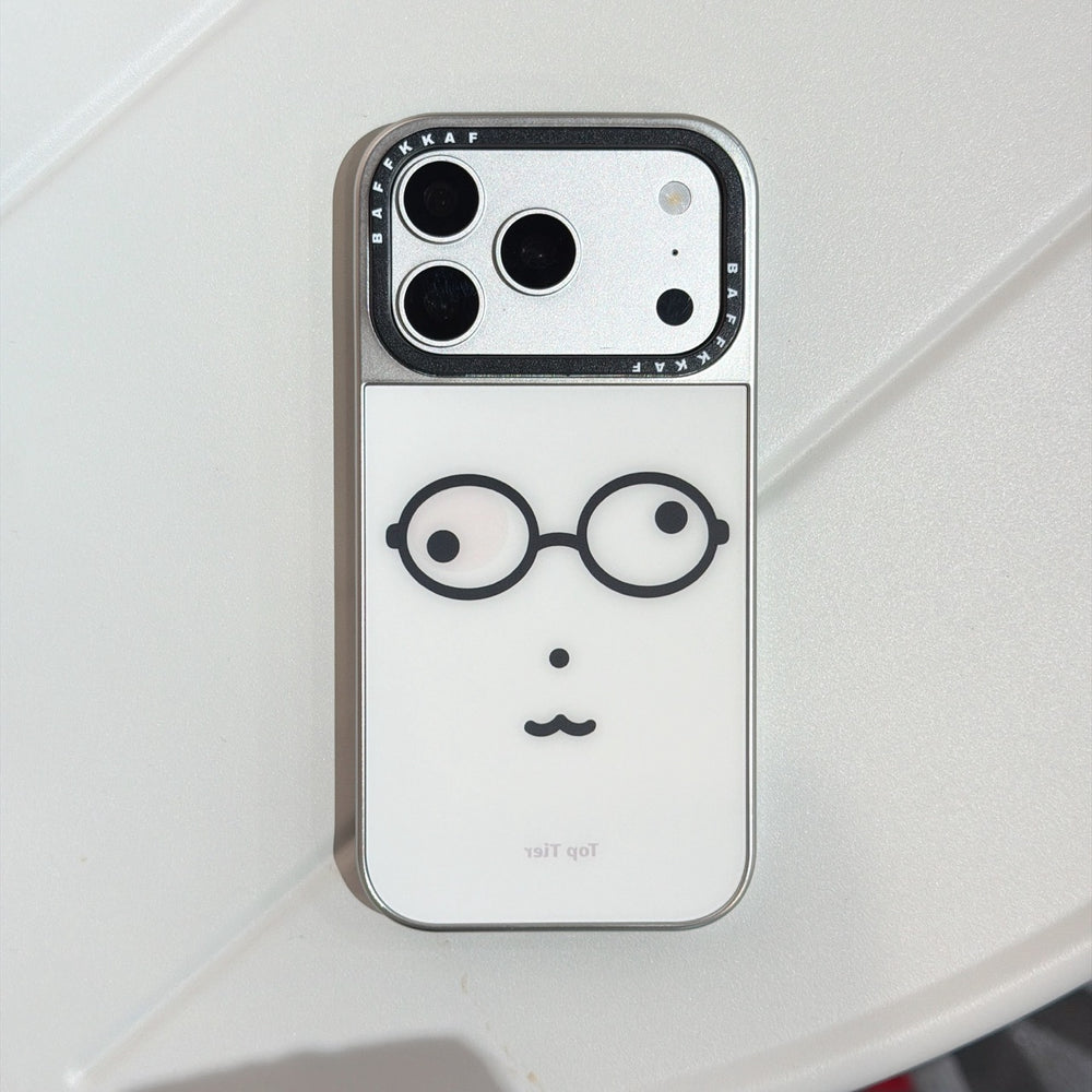 Studio product view of a funny nerd glasses face iPhone case with a silver camera frame on a clean white surface.