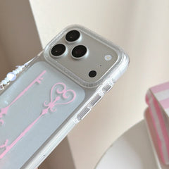 Close-up view of the glittery camera lens protection frame and bumper on the edge of the clear phone case.