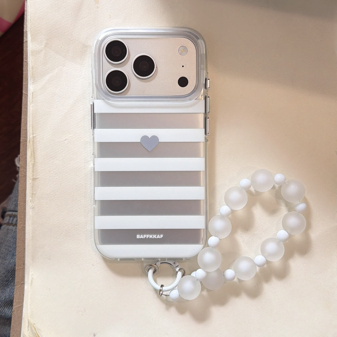 Gray striped heart clear iPhone case with white bead wrist strap