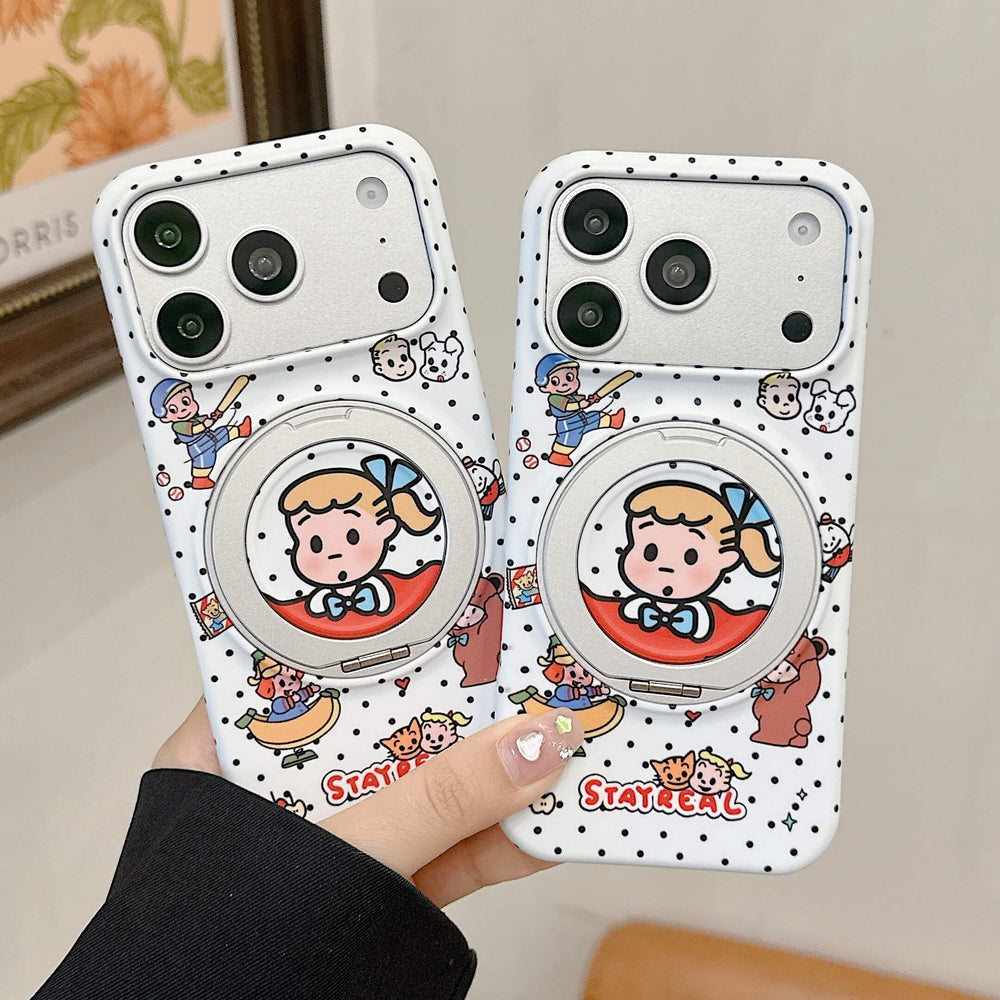 A hand holding two matching Japanese cartoon polka dot iPhone cases with silver built-in ring stands.