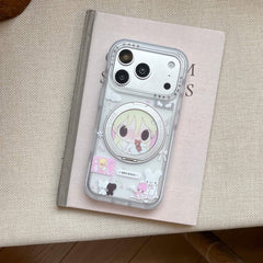 A woman in a light blue sleeveless top holding a cute Y2K anime girl iPhone case with long pearl nails.