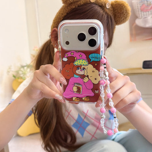 A girl taking a mirror selfie holding a kawaii cartoon dog iPhone case with a silver camera frame and pink beaded strap.