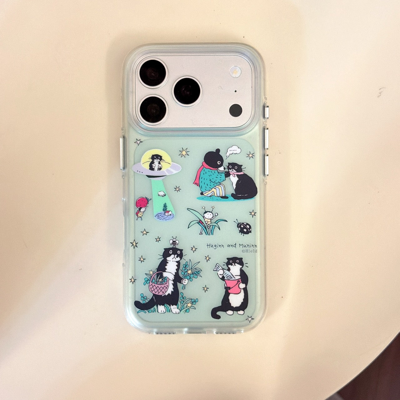 Product main view of the kawaii cat illustration mirror iPhone case in mint green with clear heavy-duty shockproof bumper frame.