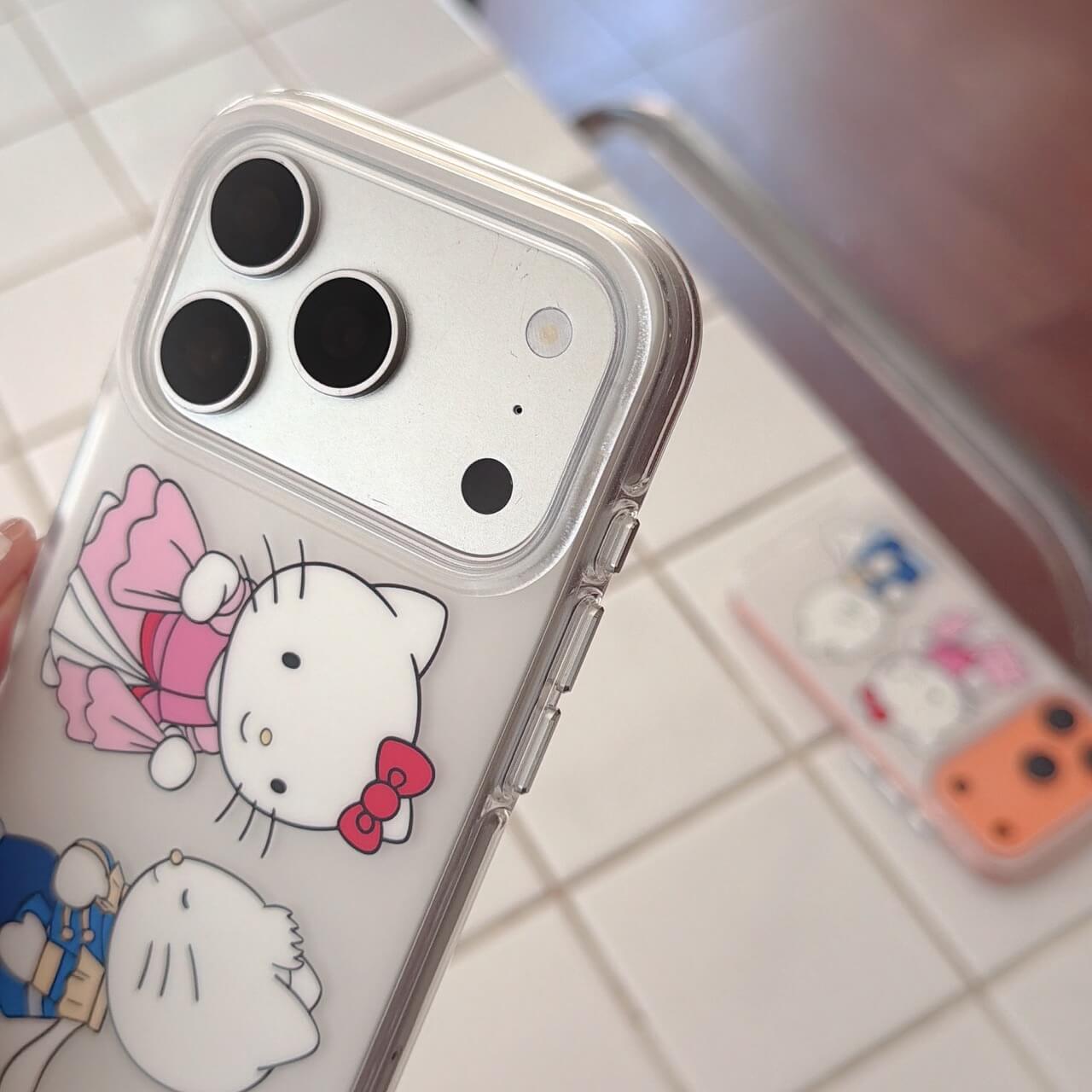 Close-up of royal kitty clear iPhone case with raised camera surround