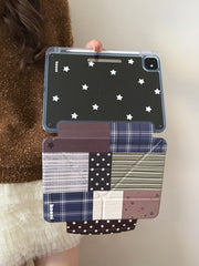 Hands demonstrating the 2-in-1 magnetic detachment of the Koooi plaid iPad cover, revealing the clear starry shell beneath the vintage collage smart flap.