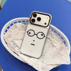 Studio view of a Korean style cute face phone shell inside a white plastic basket.