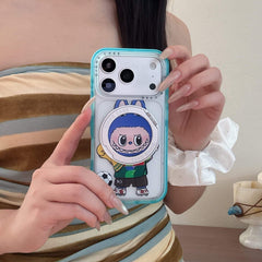 A woman holding a cute Labubu soccer iPhone case in front of her striped dress.