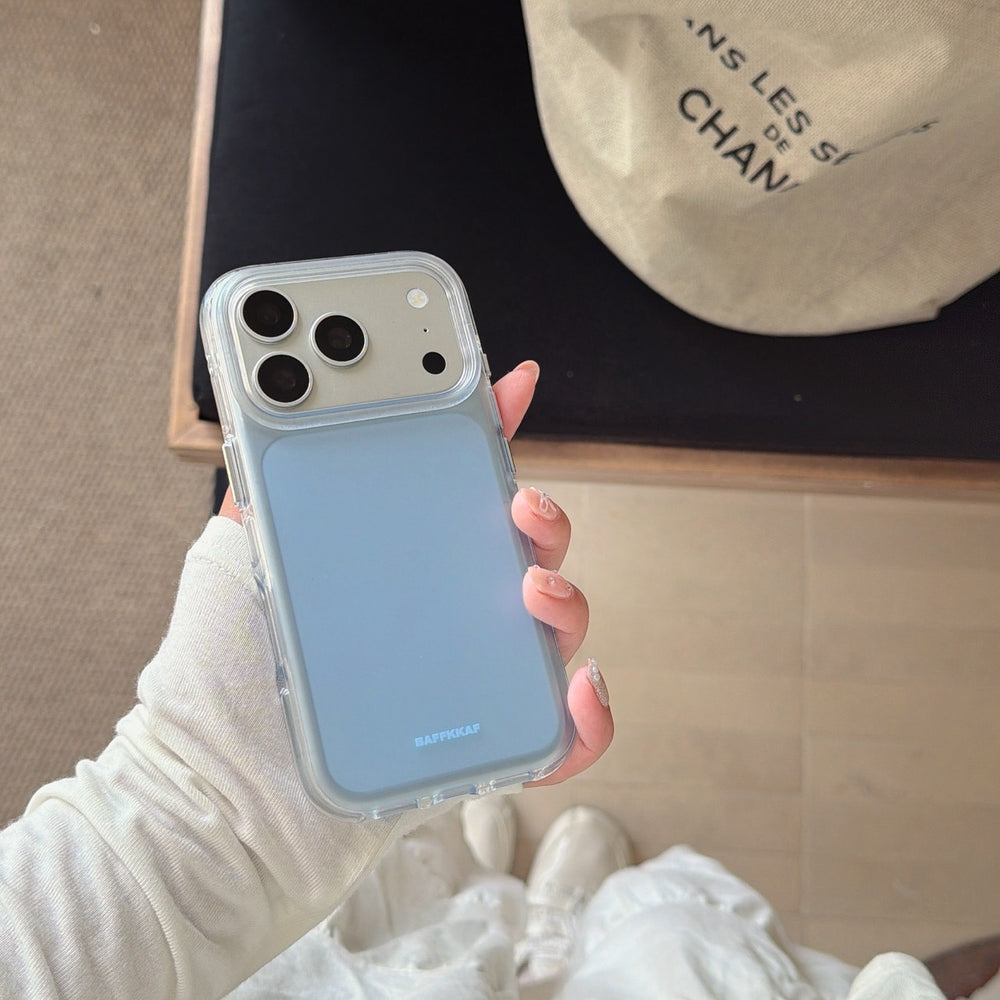 Hand holding a light blue protective phone case featuring a matte backplate and clear edges.