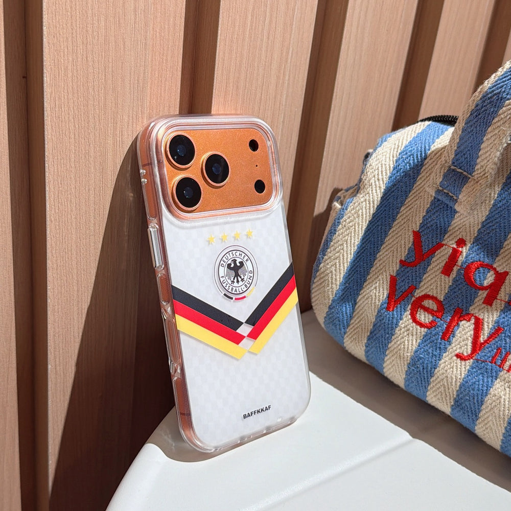 An angled shot of the luxury gold camera rim Germany football mirror case leaning against a wooden wall.