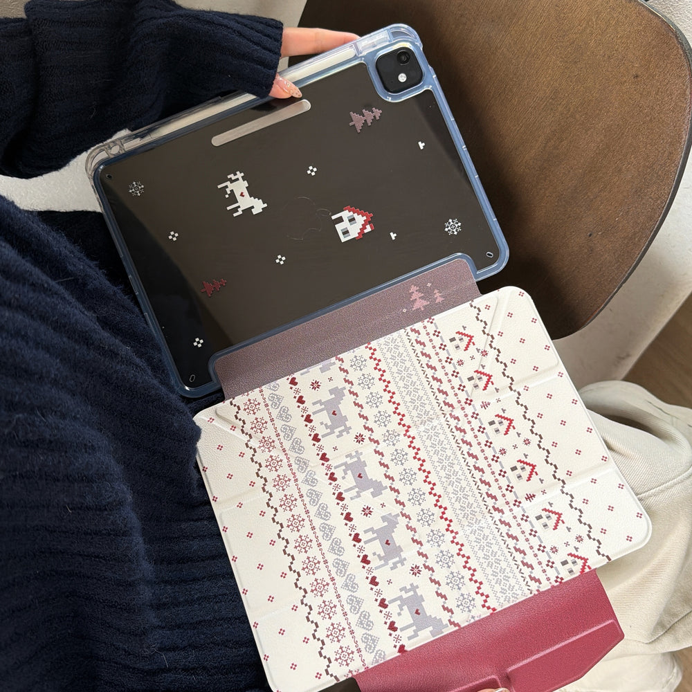 An iPad case demonstrating its 2-in-1 magnetic detachable folio feature where the clear back panel splits away from the cream Fair Isle patterned smart cover.