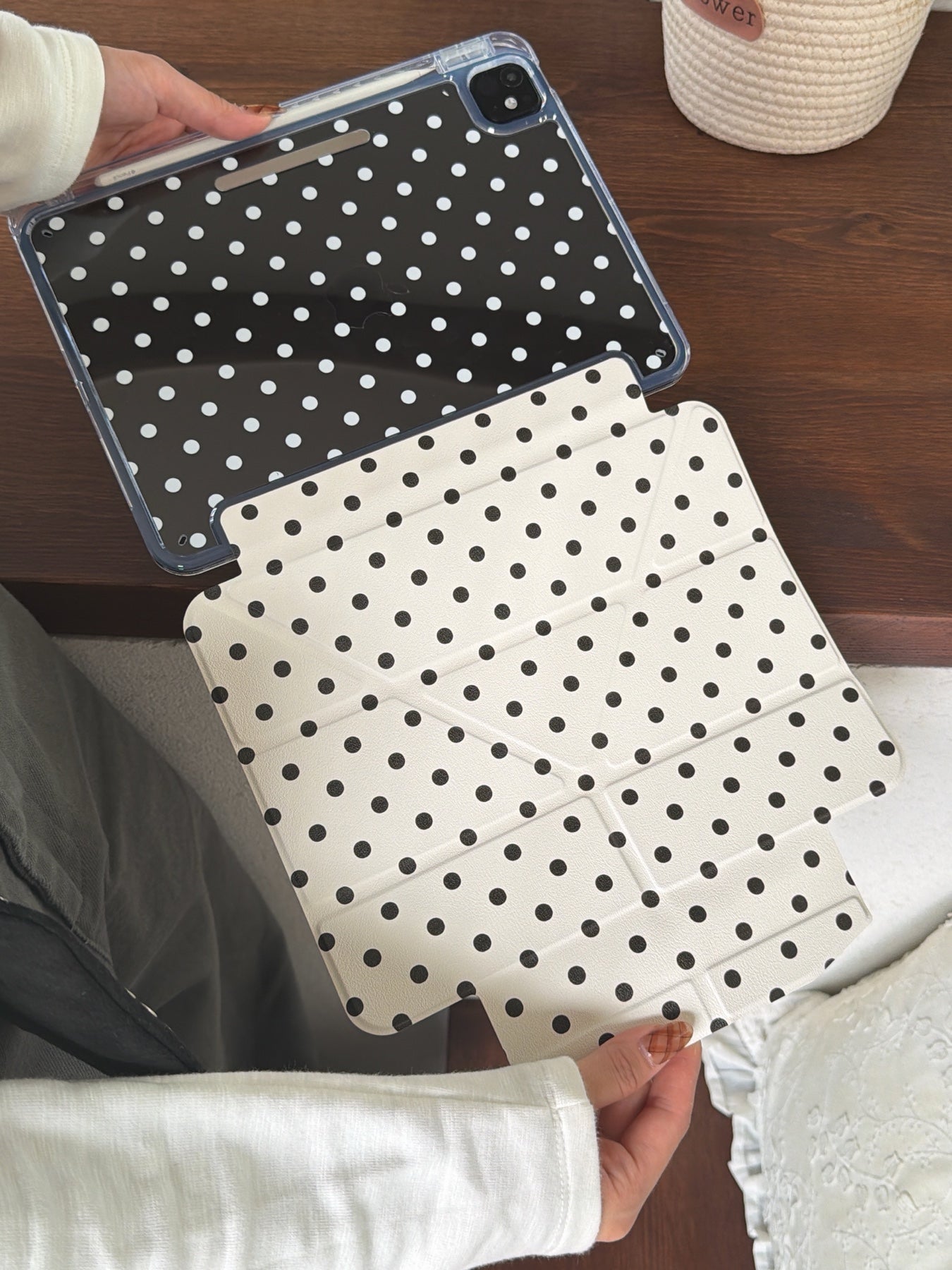 An open view of a magnetic detachable smart ipad folio showing the detached ivory polka dot front flap and a clear back casing.