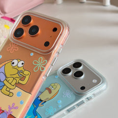 Close-up view of the glossy metallic camera deck protection frames on two clear cartoon phone cases.