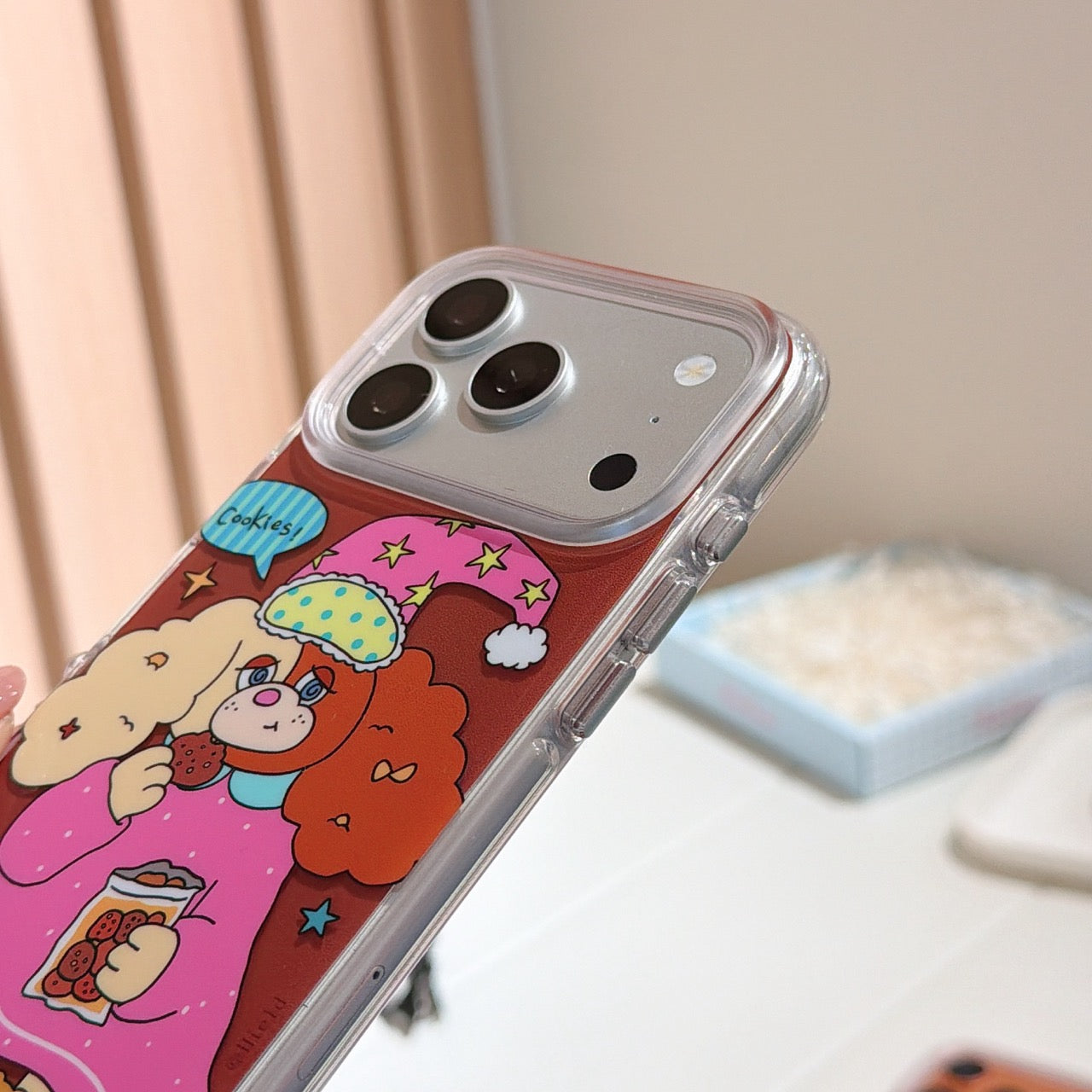 Close-up side view showing the silver metallic camera lens protection frame and clear shockproof bumper of the case.
