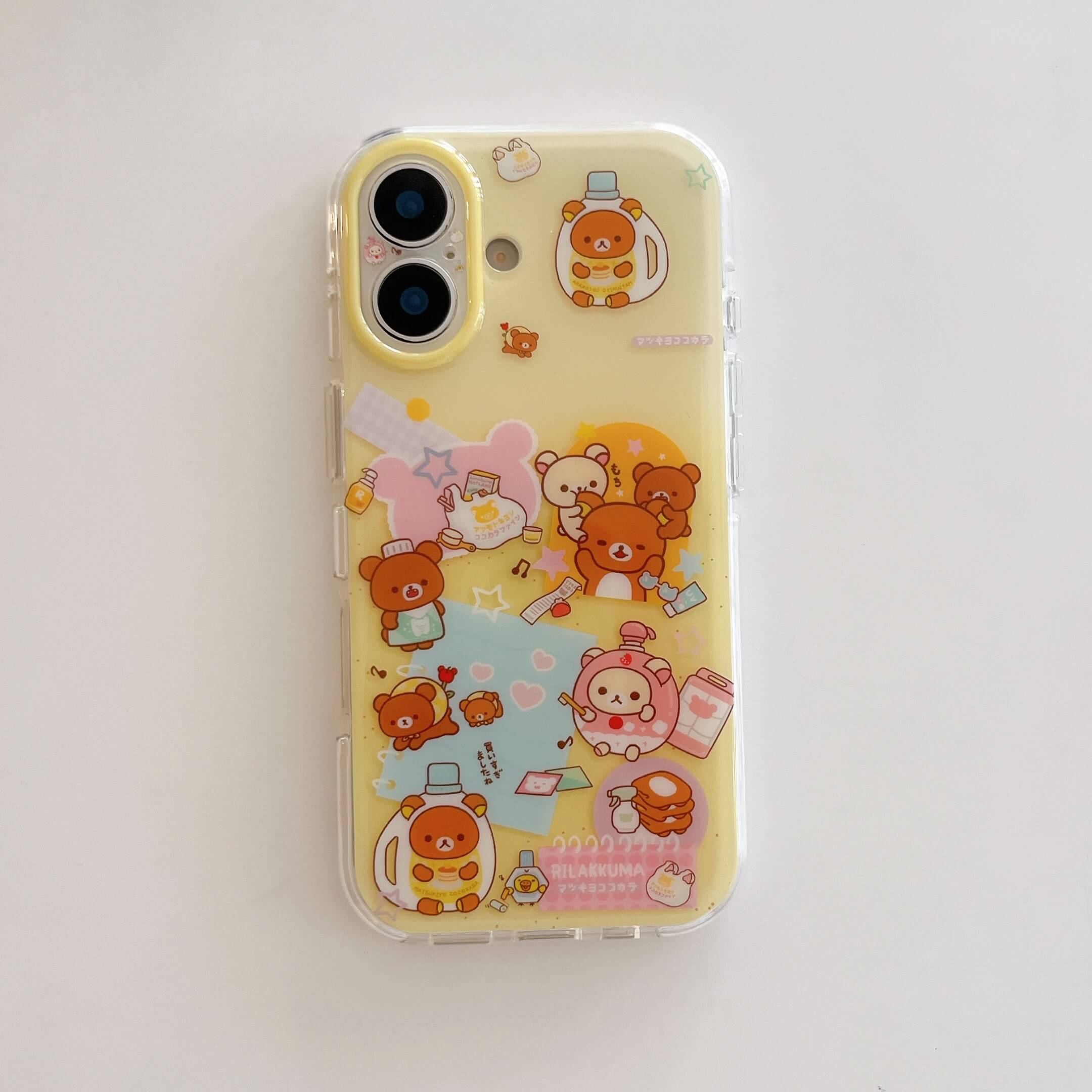 A clear, shockproof iPhone case featuring cute pastel yellow cartoon bear illustrations, centered on a plain white background.
