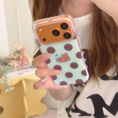 Woman holding mint chocolate polka dot kitty iPhone case with clear bumper