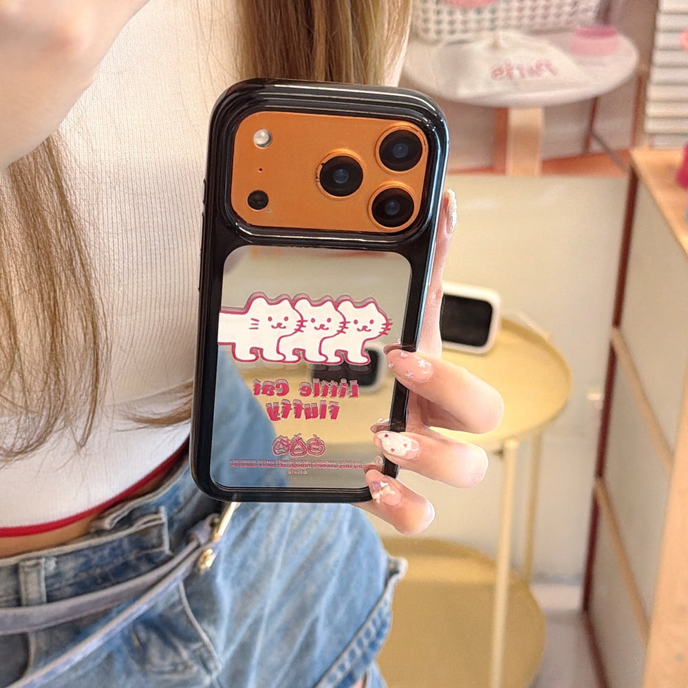 Handheld view of the vibrant orange mirror iPhone cover decorated with a minimalist little cat fluffy graphic.