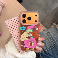 A close-up of a hand holding the orange metallic camera frame cartoon dog case against a pink polka dot card.