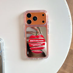 Product view of the orange tomato graphic mirror iPhone case placed flat on a clean white table.