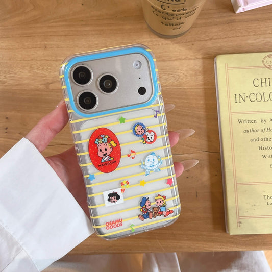 A handheld clear Osamu Goods case with yellow stripes over a wooden tabletop next to an open book.