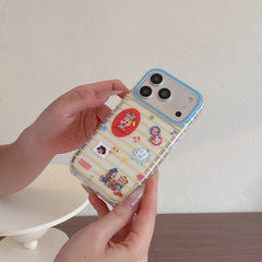 A close-up of a person holding a clear Osamu Goods iPhone case with yellow stripes and a blue camera ring.