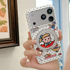 Hand holding the white polka dot phone case vertically with retro Japanese cartoon graphics visible.