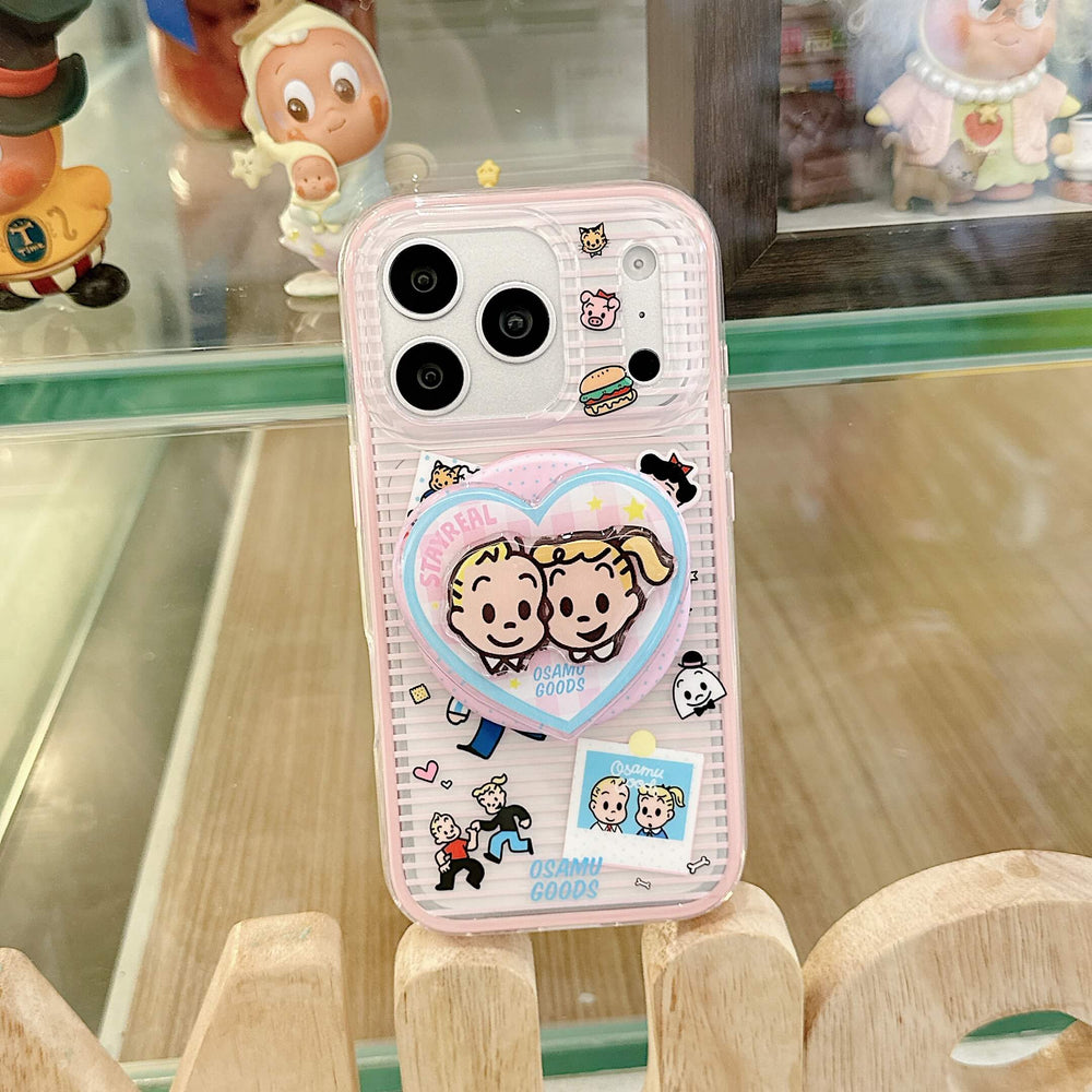 Hand holding a pink clear cartoon iPhone case with round grip design.