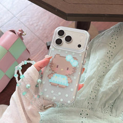 Hand holding a clear pixel kitty iPhone case with blue bow artwork