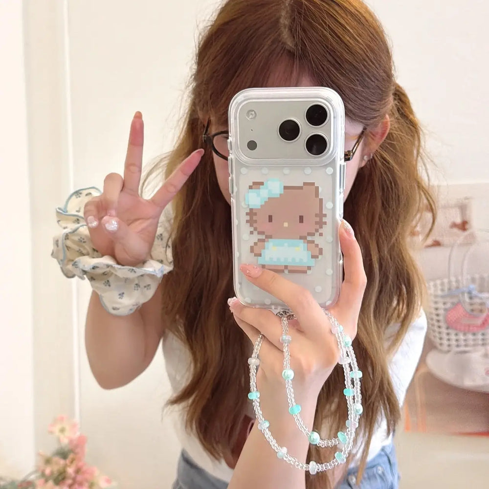 Woman holding a pixel kitty polka dot iPhone case with beaded wrist strap