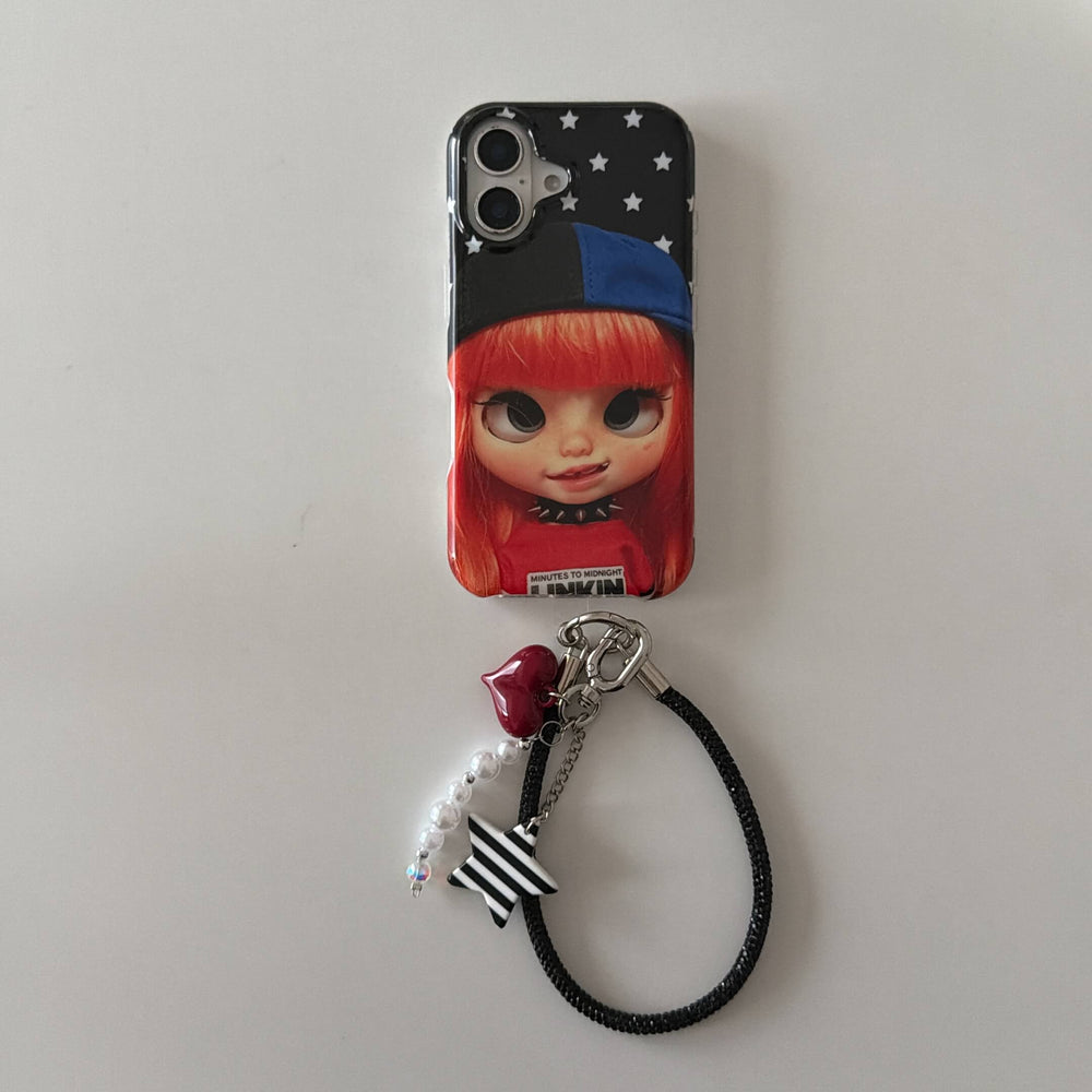 Red-haired doll iPhone case with black wrist strap and striped star charm.
