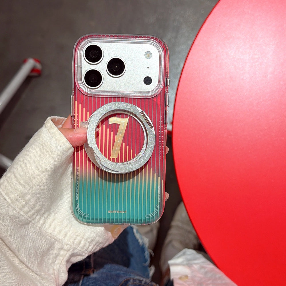 Side angle of a hand gripping a colorful gradient iPhone case with vertical stripes, focusing on the sturdy silver metal ring stand flipped outwards.