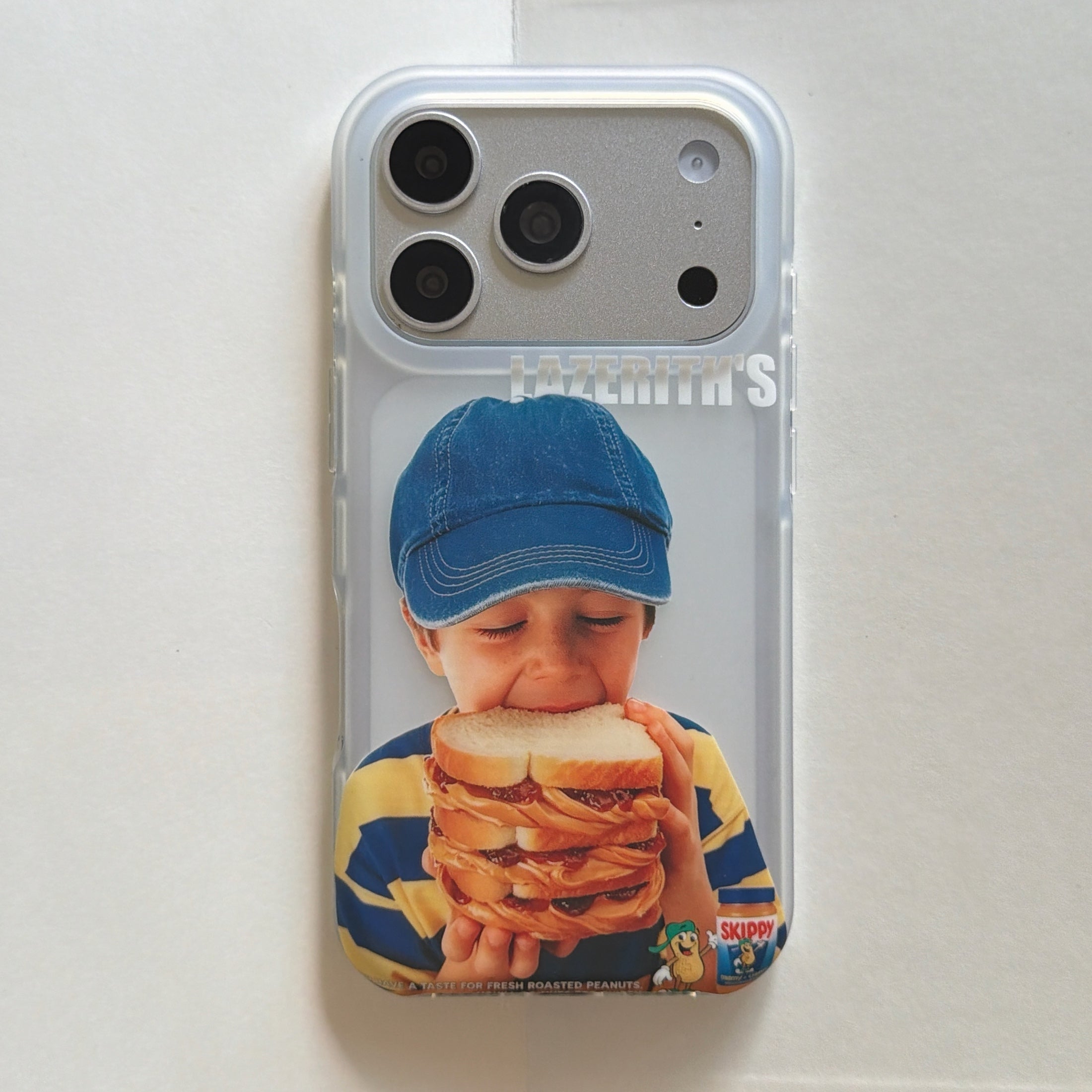 A flat lay vertical view of a retro boy eating sandwich clear iPhone case.