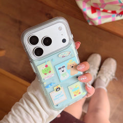 A lifestyle view of a transparent mint green phone cover with cute animal graphics held by a girl wearing sneakers.