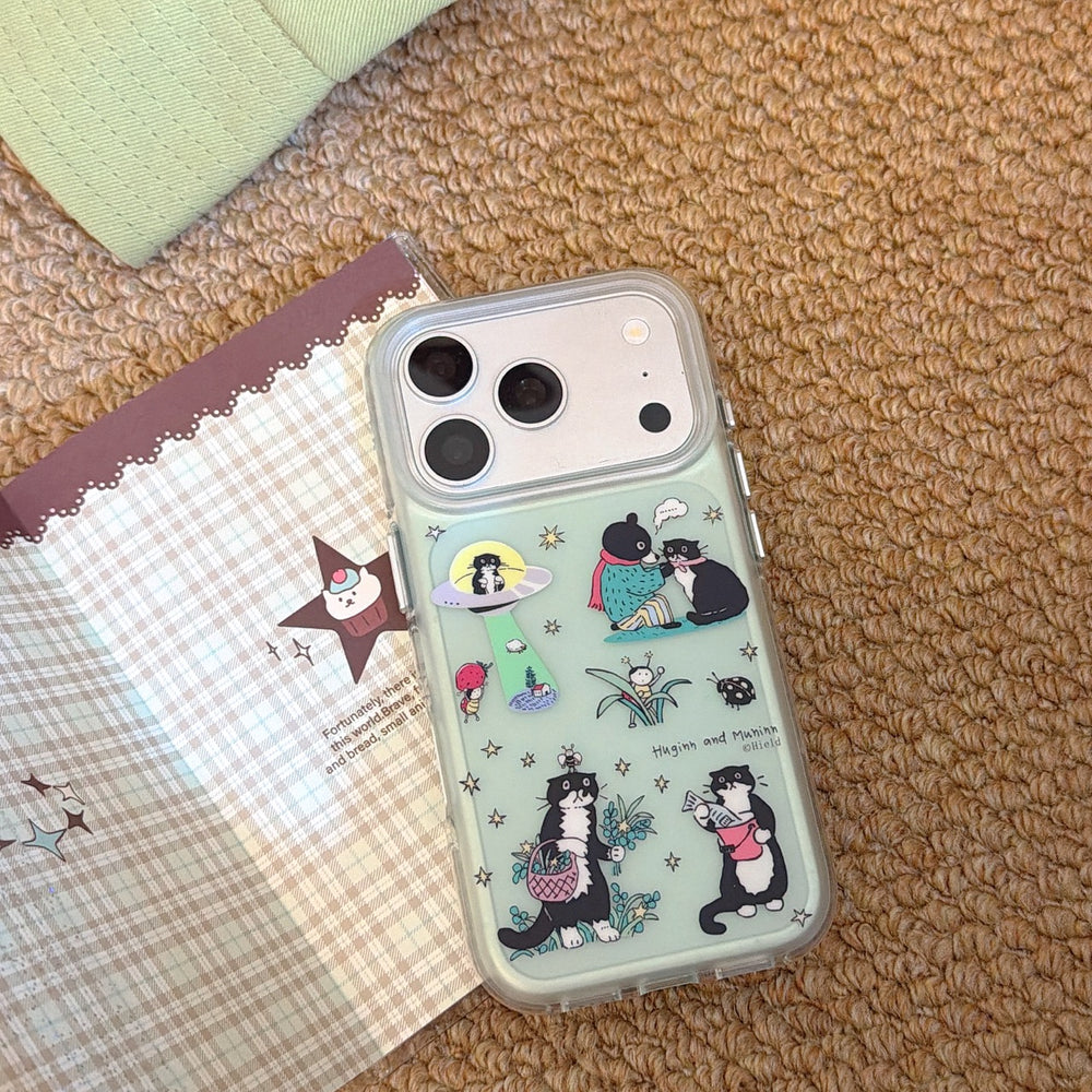 Cute mint green mirror phone case with shockproof clear bumper edges layered next to a plaid notebook.
