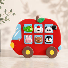 A clean studio product display of the shockproof silicone kids iPad case standing stably on a marble tabletop with soft leaf shadows on the background wall.