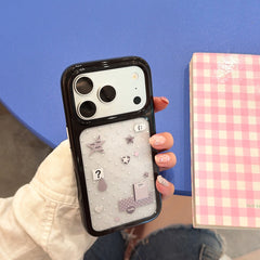 Hand holding a silver glitter star selfie mirror case for iPhone next to a pink checkered notebook.
